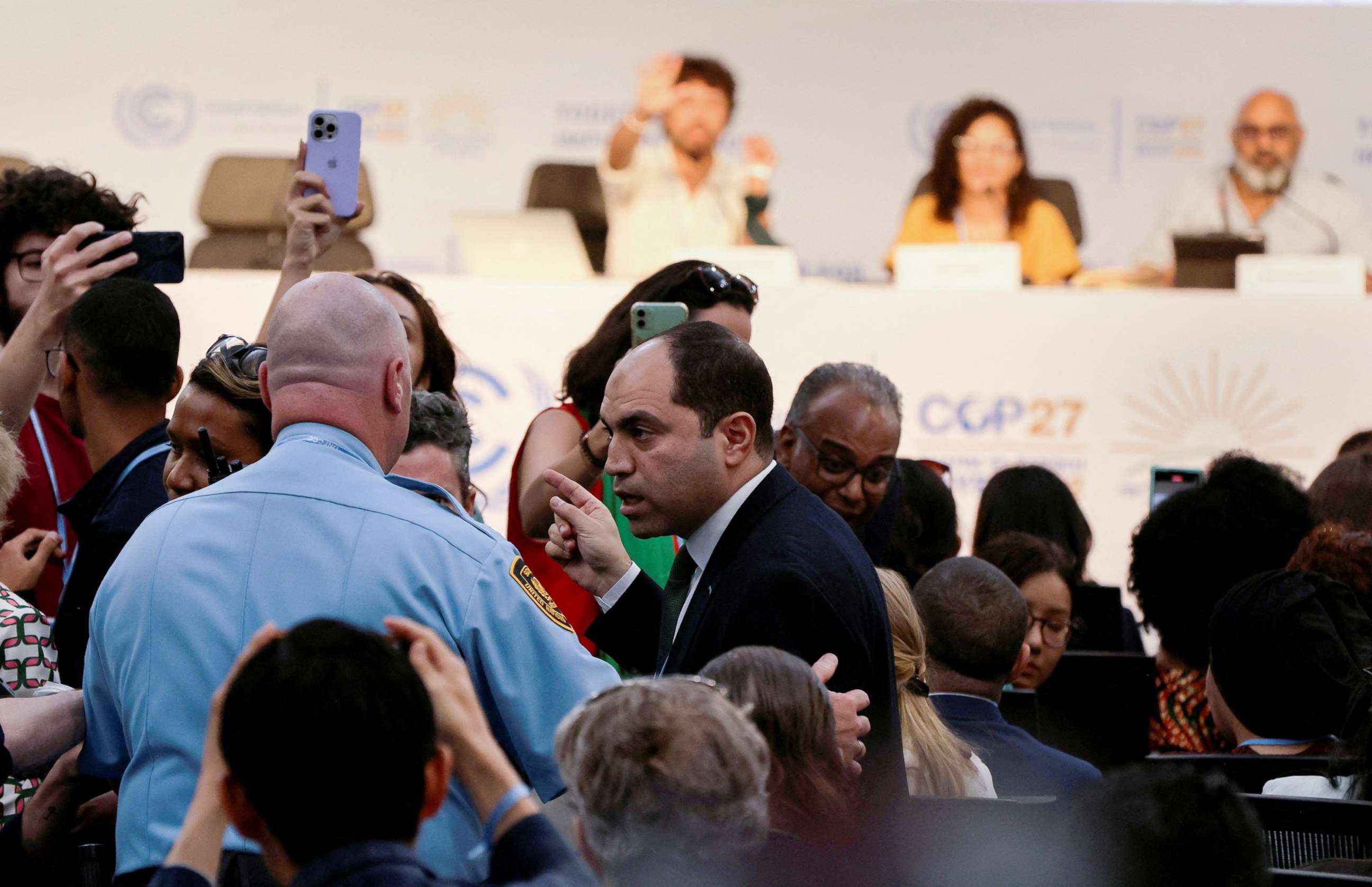 PHOTO: Amr Darwish, an Egyptian MP is escorted out after he criticized the sister of Egyptian-British hunger striker Alaa Abd el-Fattah during a news conference at the COP27 climate summit in Red Sea resort at Sharm el-Sheikh, Egypt, November 8, 2022.