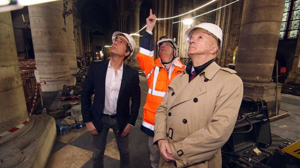 PHOTO: ABC News' David Muir walks through the fire-damaged Notre Dame cathedral in Paris with retired French General Jean-Louis Georgelin in May 2019, nearly a month after a devastating fire.