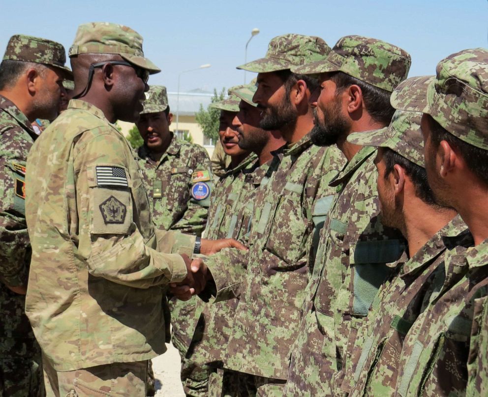 PHOTO: Maj. Dawud Agbere, left, talks with Afghan sholdiers at Camp Shaheen in Afghanistan. Agbere is the only Muslim U.S. Army chaplain in Afghanistan.