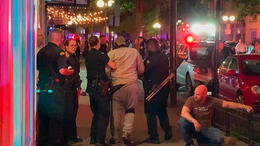 PHOTO: In this image made from video provided by Jeff Oaks, first responders help walk an injured person to safety after a deadly shooting in Dayton, Ohio, Aug. 4, 2019.
