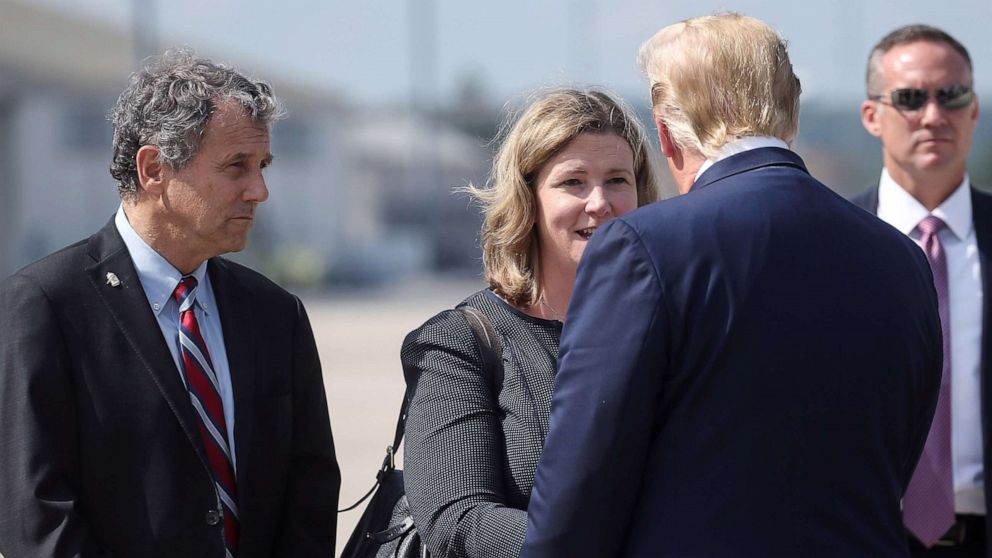 PHOTO: President Donald Trump is greeted by Dayton, Ohio, Mayor Nan Whaley as 
Sen. Sherrod Brown waits at left, as Trump arrived at Wright-Patterson Air Force Base before visiting the site of a mass shooting in Dayton, Ohio, Aug. 7, 2019.