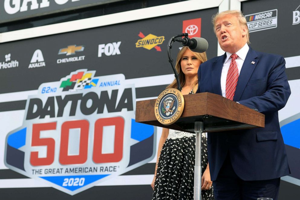 PHOTO:President Donald Trump speaks as First Lady Melania Trump looks on from Victory Lane prior to the NASCAR Cup Series 62nd Annual Daytona 500 at Daytona International Speedway, Feb. 16, 2020 in Daytona Beach, Fla. 