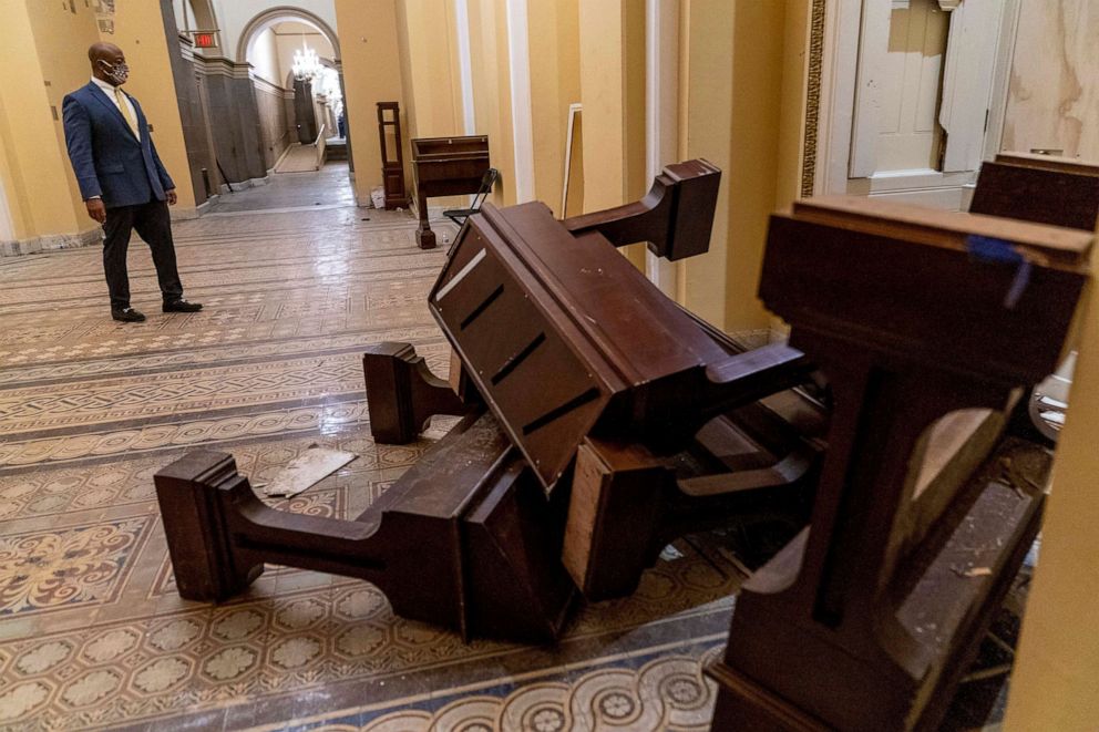 PHOTO: Sen. Tim Scott stops to look at damage, Jan. 7, 2021, after protesters stormed the Capitol in Washington, D.C. on Jan. 6.