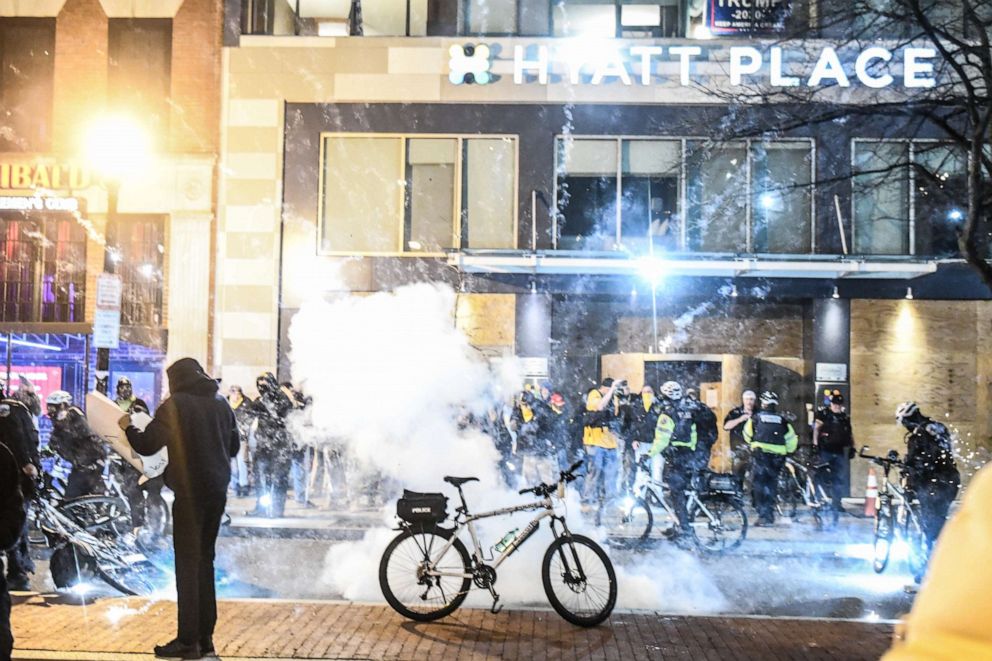 PHOTO: An explosion goes off in front of a hotel where the Proud Boys are staying during a protest on Dec. 12, 2020, in Washington, D.C.