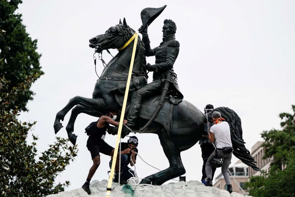 PHOTO: Protesters attempt to pull down the statue of President Andrew Jackson in the middle of Lafayette Park in front of the White House during racial inequality protests, June 22, 2020.