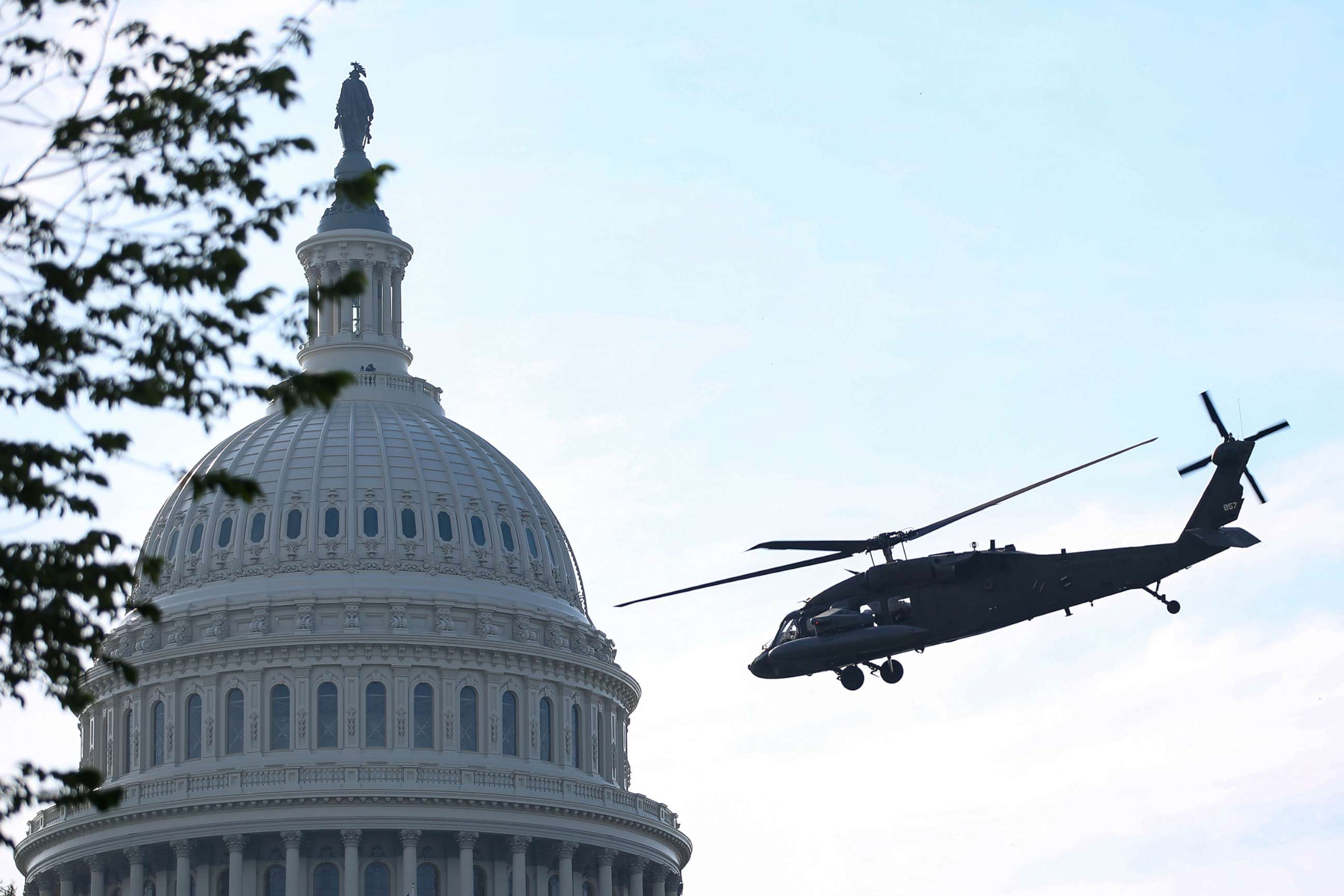 PHOTO: Black Hawk UH-60 Lima U.S. military helicopters perform in a routine training exercise at the Capitol in Washington, D.C., June 7, 2021.