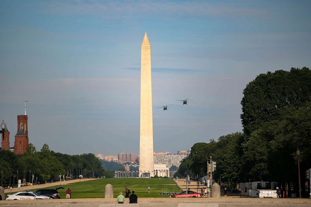 PHOTO: Black Hawk UH-60 Lima U.S. military helicopters perform in a routine training exercise in Washington, D.C., June 7, 2021.