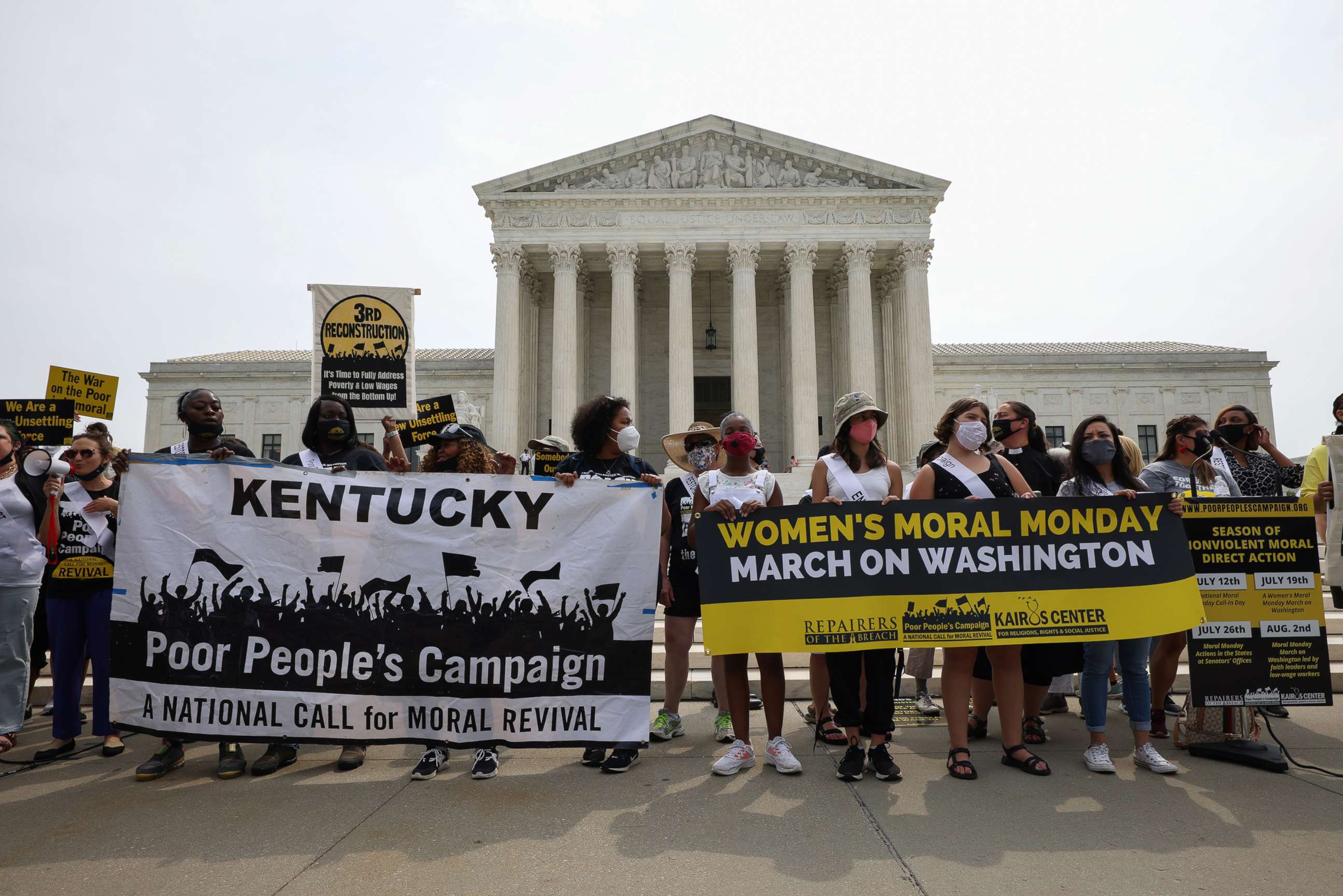 PHOTO: People hold up signs in front of the Supreme Court, July 19, 2021, in Washington, D.C.