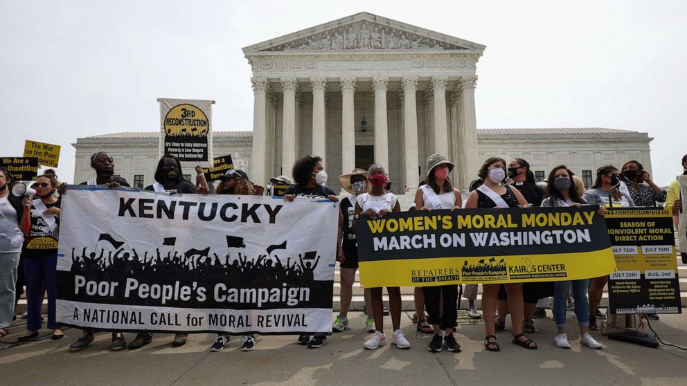 PHOTO: People hold up signs in front of the Supreme Court, July 19, 2021, in Washington, D.C.