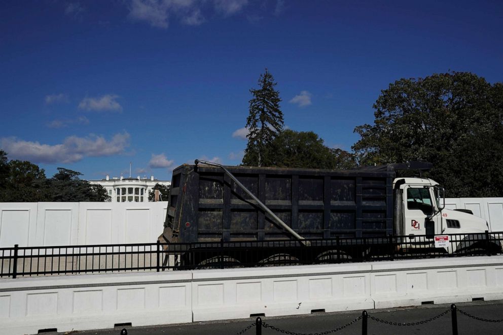PHOTO: A dump truck drives on the South side of the White House, the day before the presidential election, in Washington, Nov. 2, 2020.
