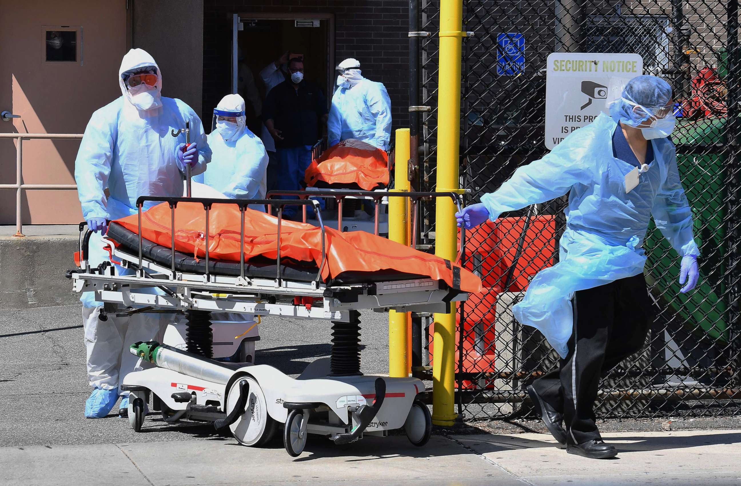 PHOTO: Medical staff move bodies from the Wyckoff Heights Medical Center to a refrigerated truck, on April 2, 2020, in Brooklyn, New York.