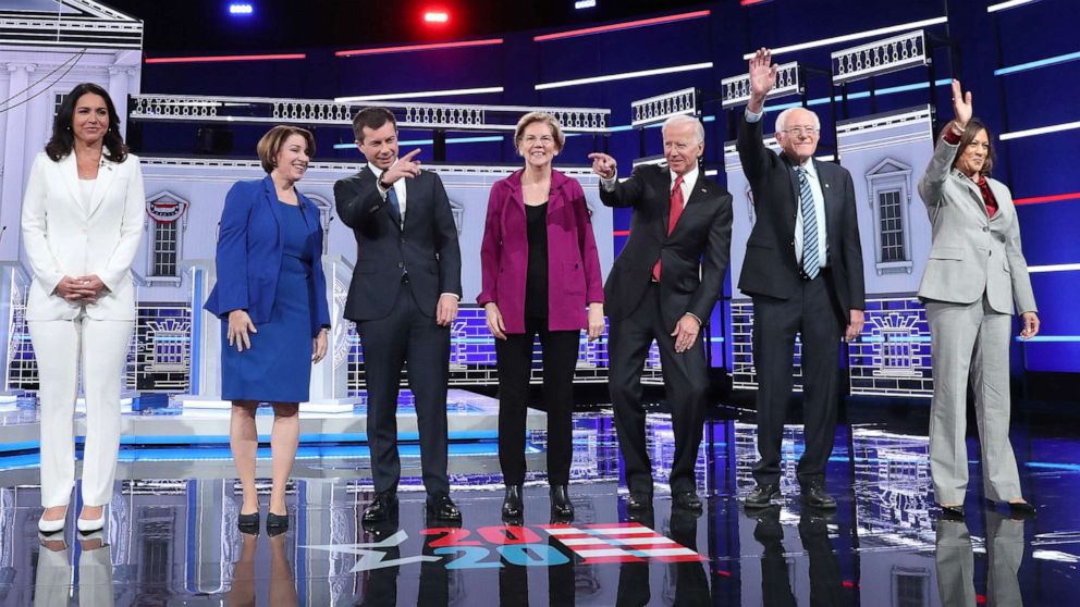 PHOTO: Democratic presidential candidates arrive on stage before the start of the Democratic Presidential Debate, Nov. 20, 2019, in Atlanta.