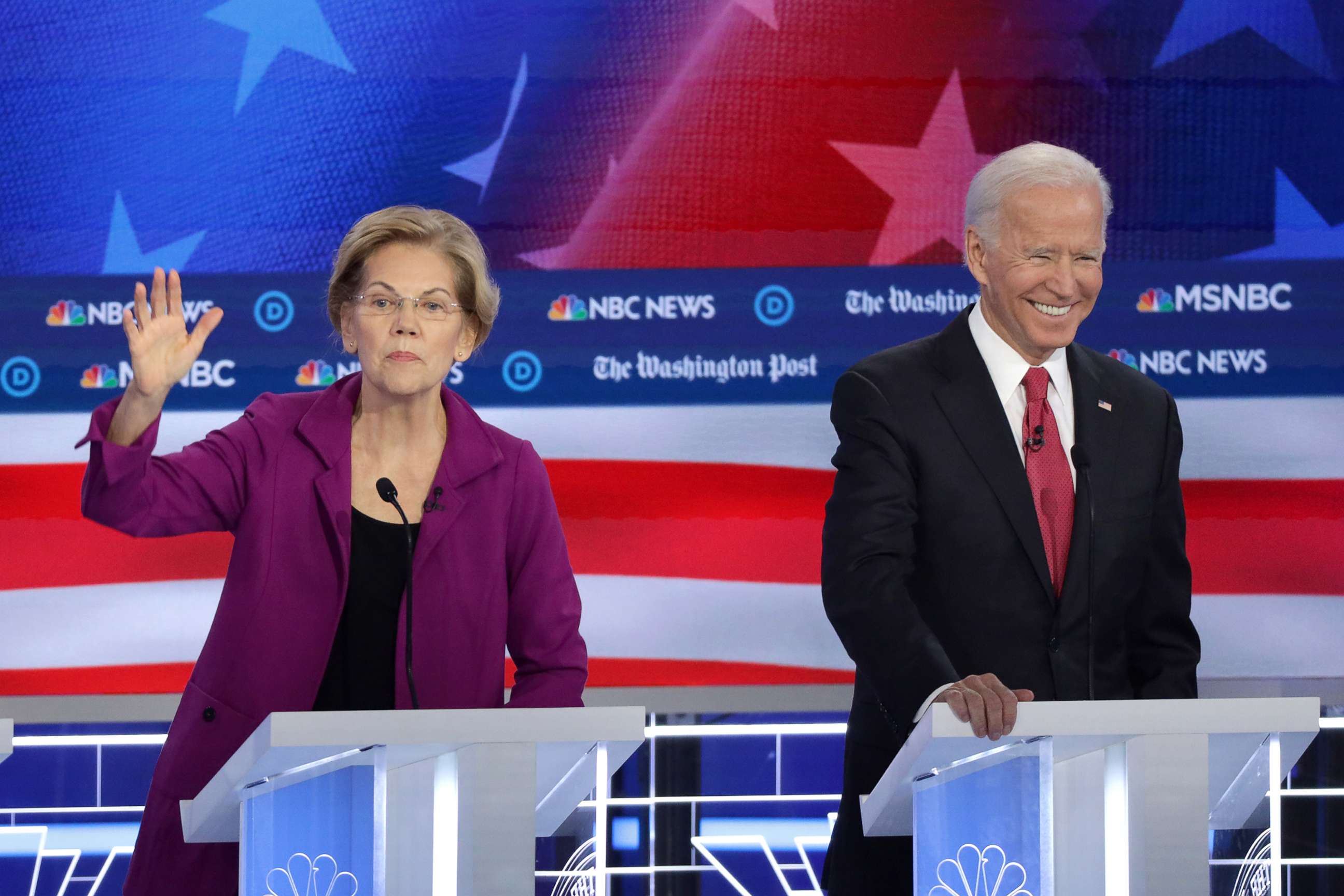 PHOTO:Sen. Elizabeth Warren (D-MA) speaks as former Vice President Joe Biden smiles during the Democratic Presidential Debate, Nov. 20, 2019, in Atlanta.