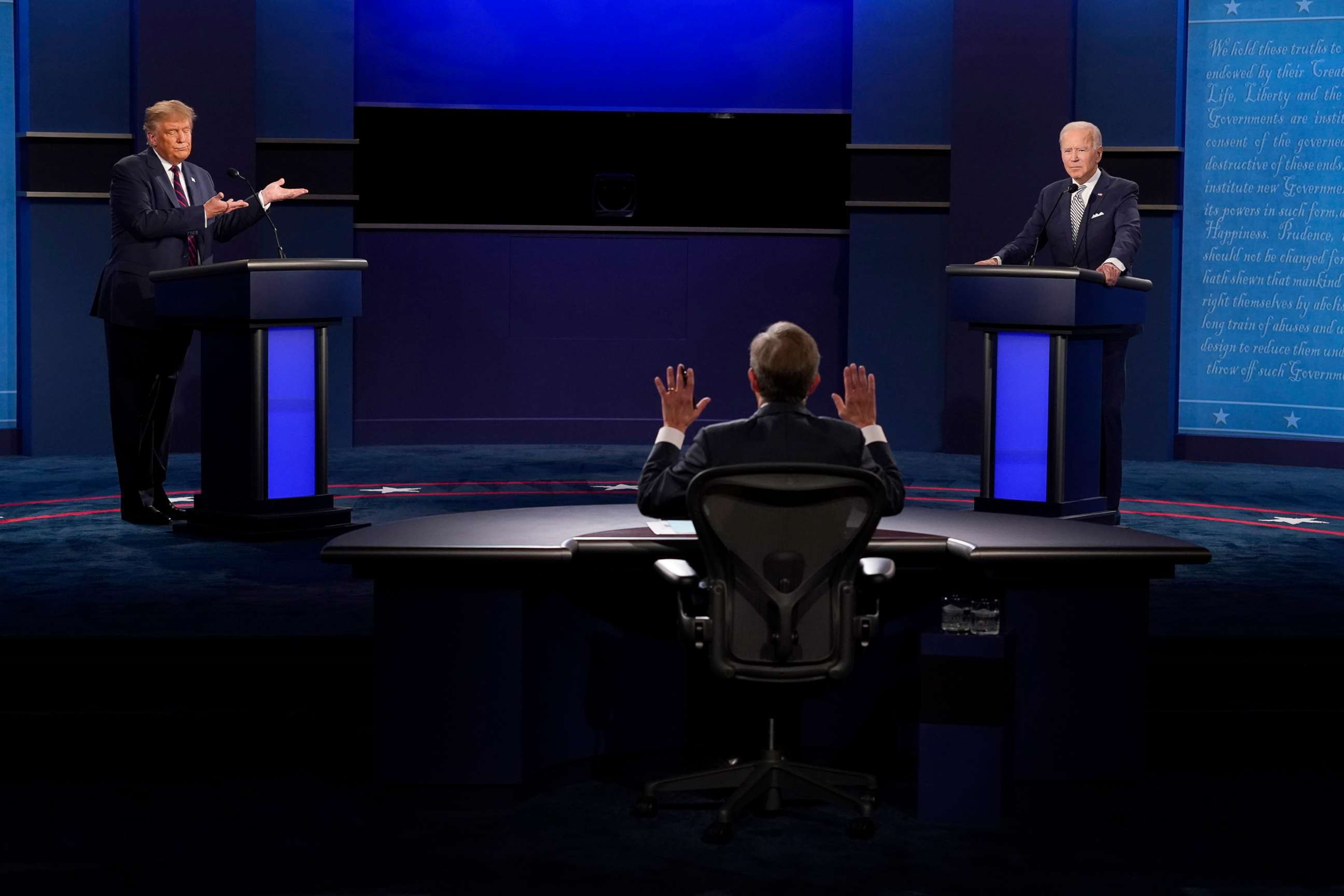 PHOTO: Moderator Chris Wallace of Fox News, center, gesturing during the first presidential debate between President Donald Trump, left, and Democratic presidential candidate former Vice President Joe Biden, right, Sept. 29, 2020, in Cleveland.