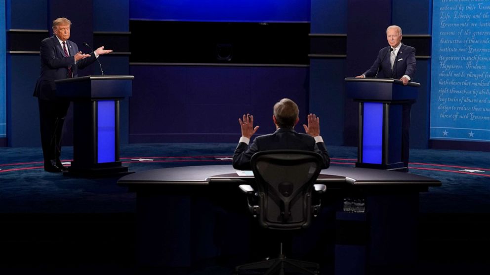 PHOTO: Moderator Chris Wallace of Fox News, center, gesturing during the first presidential debate between President Donald Trump, left, and Democratic presidential candidate former Vice President Joe Biden, right, Sept. 29, 2020, in Cleveland.