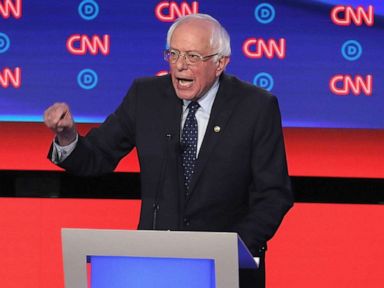 PHOTO: Democratic presidential candidates Sen. Bernie Sanders (I-VT) (C) speaks while Sen. Elizabeth Warren (D-MA) and South Bend, Indiana Mayor Pete Buttigieg (L) listen at the beginning of the Democratic Presidential Debate, July 30, 2019, in Detroit.