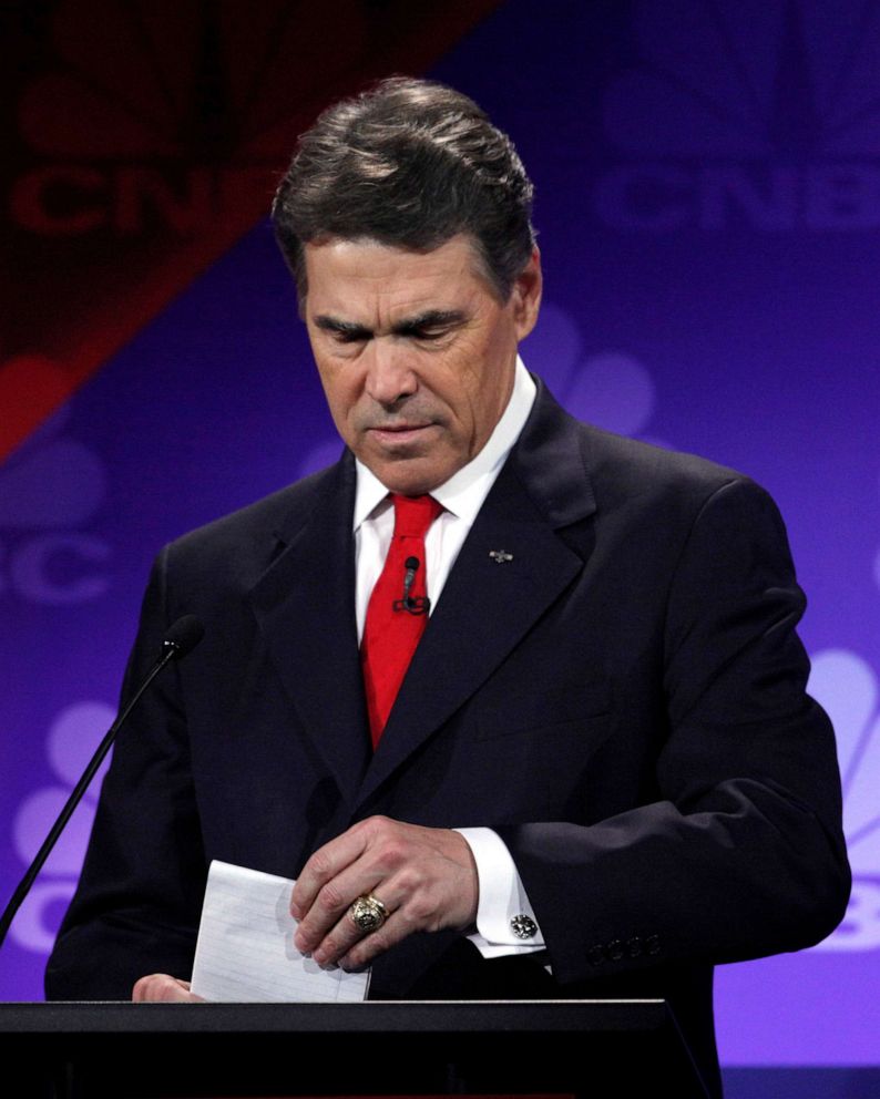 PHOTO: Republican presidential candidate Texas Gov. Rick Perry looks at his notes during a Republican Presidential Debate at Oakland University, Nov. 9 2011, in Auburn Hills, Mich.