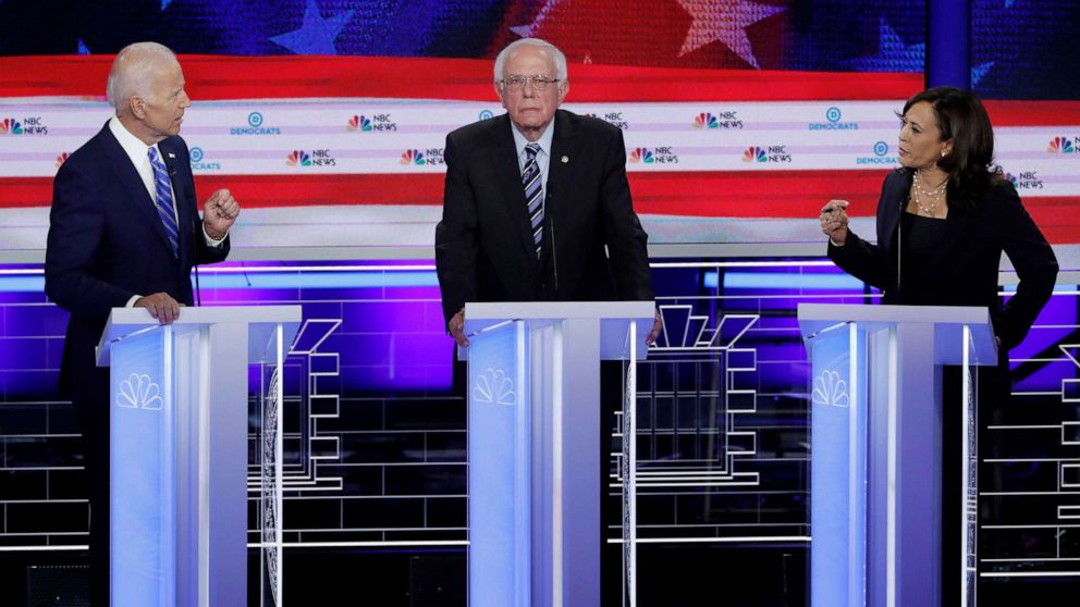 PHOTO: Former Vice President Joe Biden and Senator Kamala Harris debate as Senator Bernie Sanders listens during the second night of the first U.S. Democratic presidential candidates 2020 election debate in Miami, Fla., June 27, 2019.