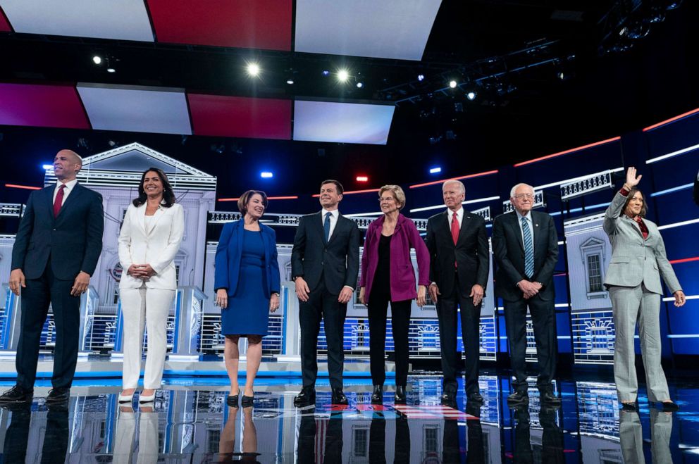 PHOTO: Presidential candidates appear on stage at the start of the Democratic presidential debate at Tyler Perry Studios, Nov. 20, 2019, in Atlanta.