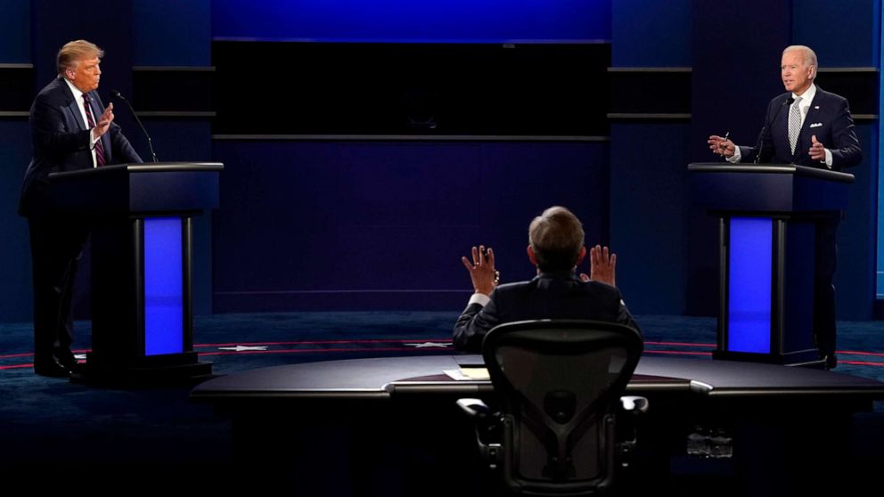 PHOTO: Chris Wallace of Fox News tries to moderate as President Donald Trump and Democratic candidate former Vice President Joe Biden both speak during the first presidential debate, Sept. 29, 2020, in Cleveland.