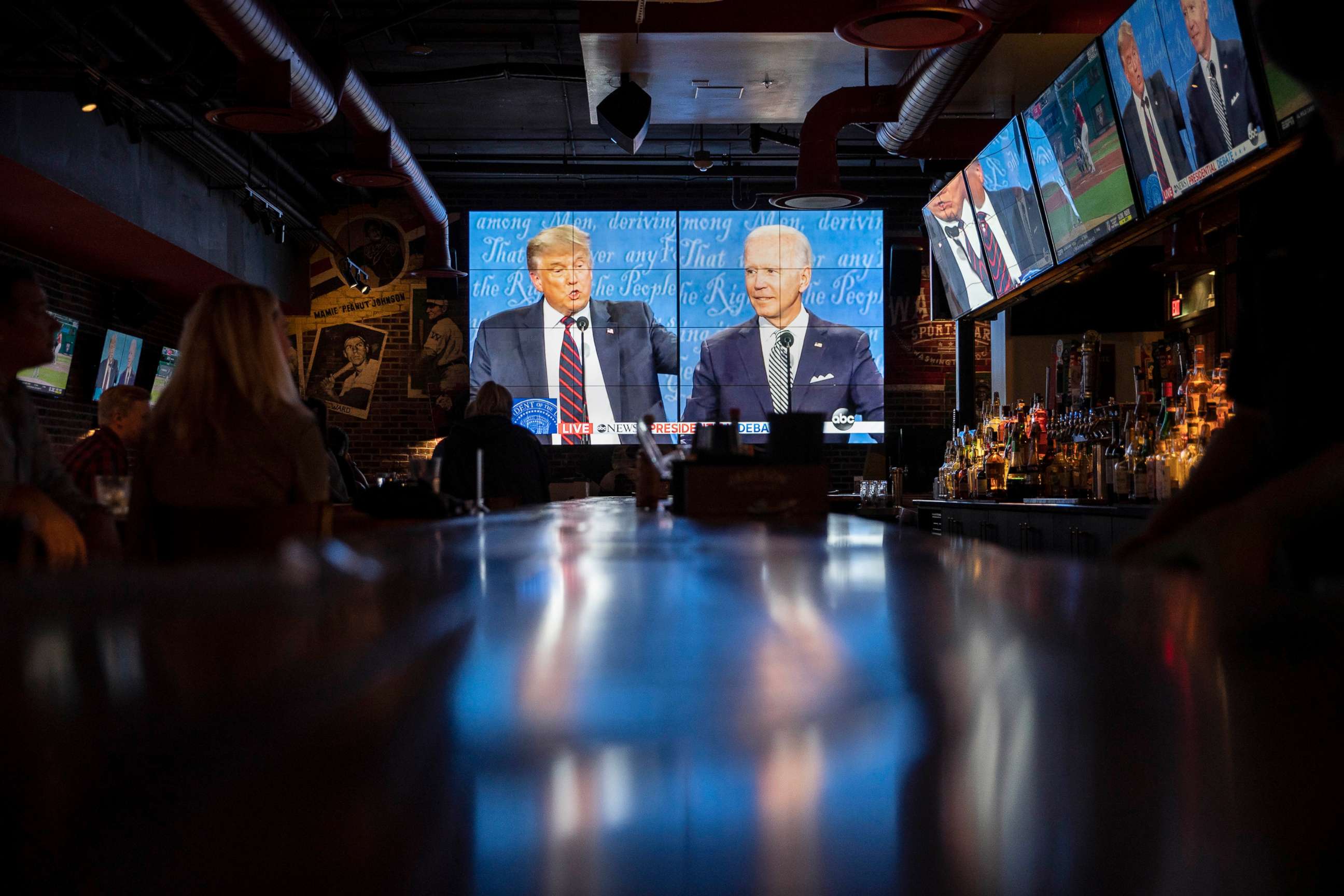 PHOTO: People watch the first presidential debate at a Walter's Sports Bar, Sept. 29, 2020, in Washington, D.C.