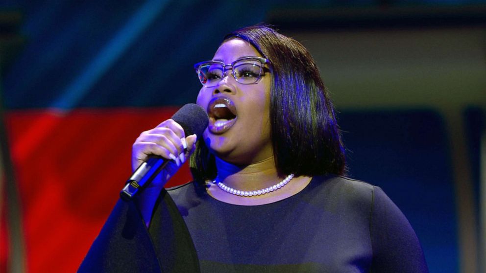 PHOTO: Breanna Lindsey, 20, sings the national anthem at the Democratic presidential primary debate hosted by ABC News in Houston, Sept. 12, 2019.