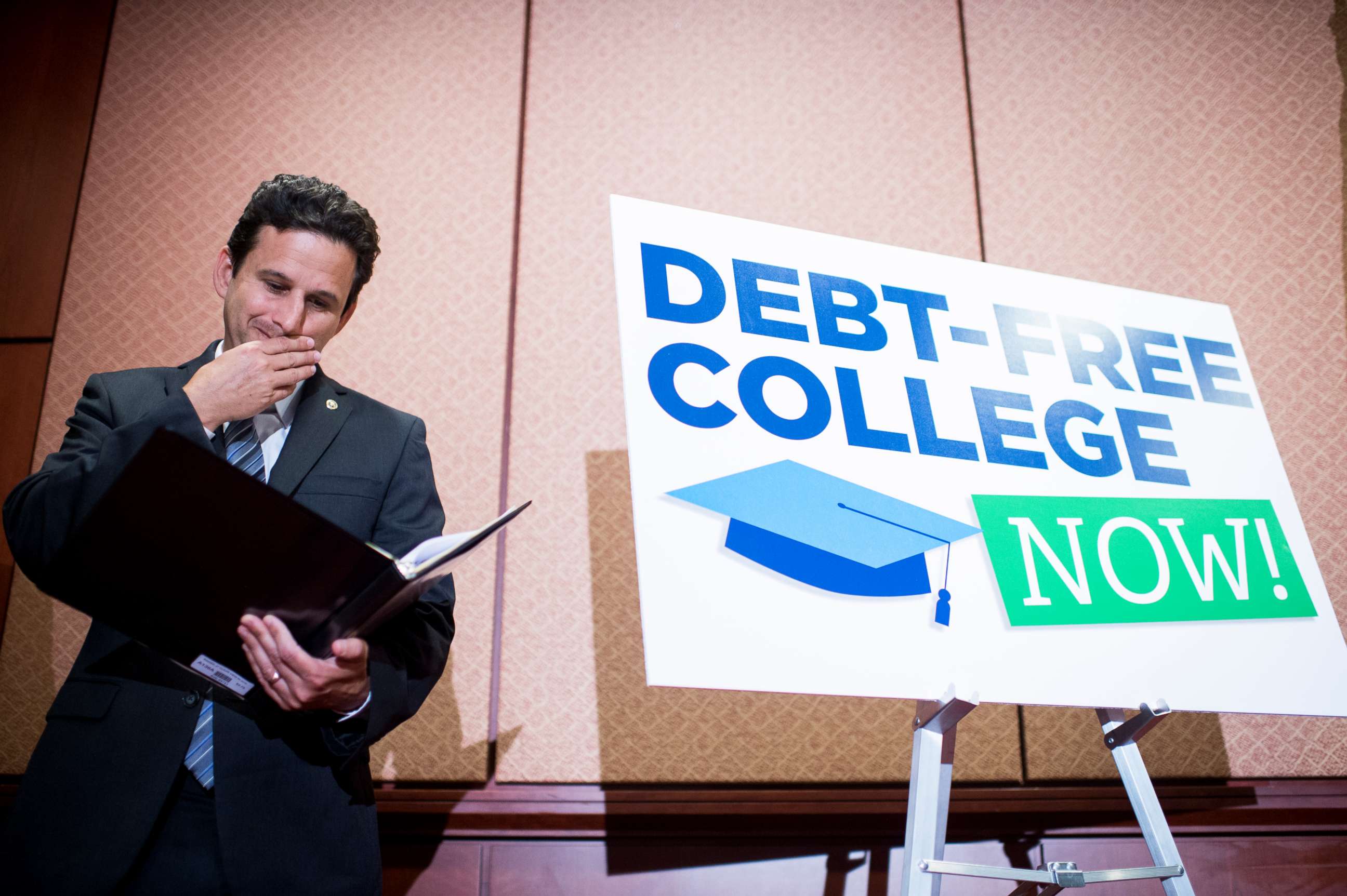 PHOTO: Sen. Brian Schatz, D-Hawaii, looks over his notes during the press conference in the Capitol to call for the elimination of student loan debt at public higher education institutions on Wednesday, June 10, 2015.