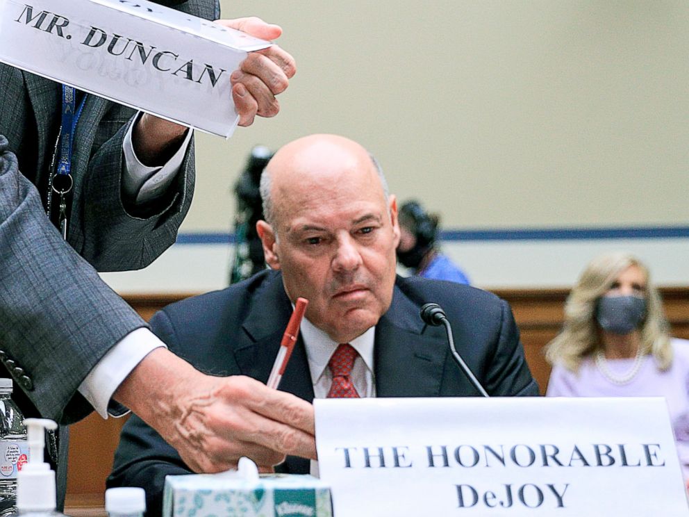 PHOTO: Postmaster General Louis DeJoy is seated to testify during a House Oversight and Reform Committee hearing on slowdowns at the Postal Service ahead of the November elections on Capitol Hill, Aug. 24, 2020. 