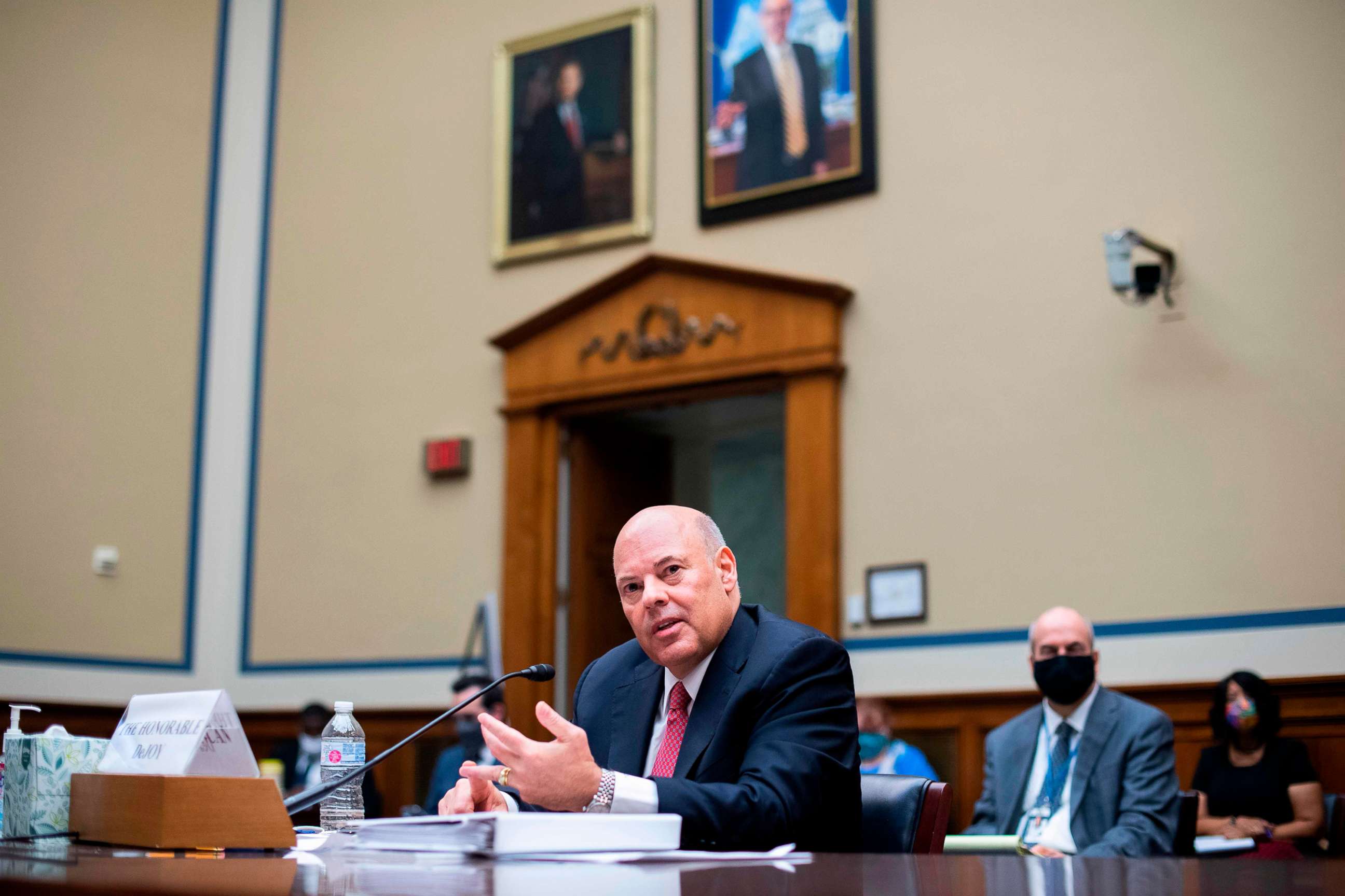 PHOTO: Postmaster General Louis DeJoy testifies during a House Oversight and Reform Committee hearing on slowdowns at the Postal Service ahead of the November elections on Capitol Hill in Washington, DC., Aug. 24, 2020.