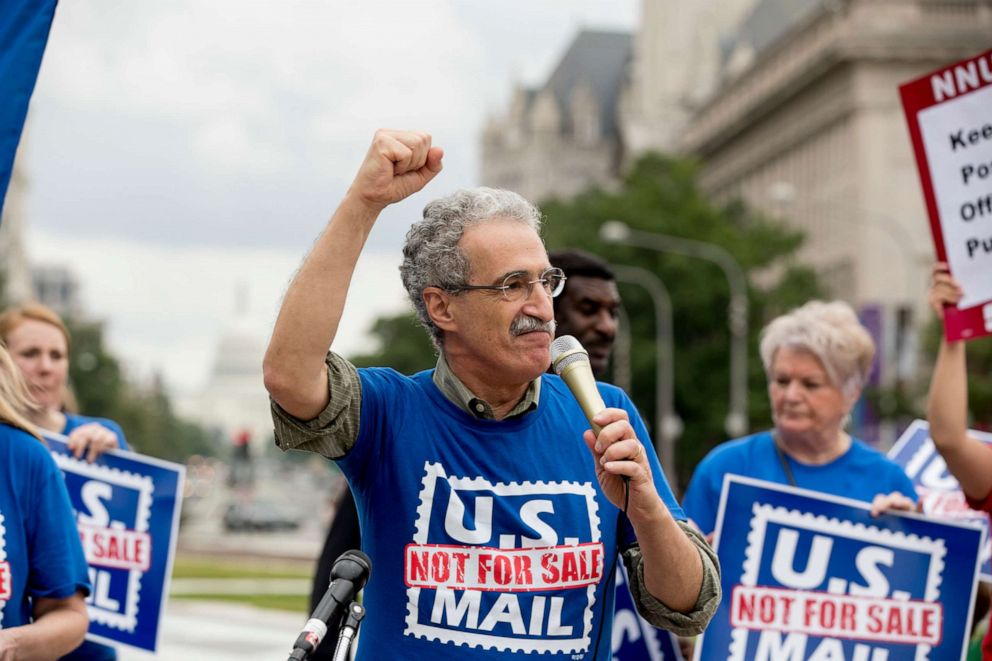 PHOTO: American Postal Workers Union president Mark Dimondstein pumps his fist while speaking at a rally at Freedom Plaza, Washington, Oct. 8, 2018