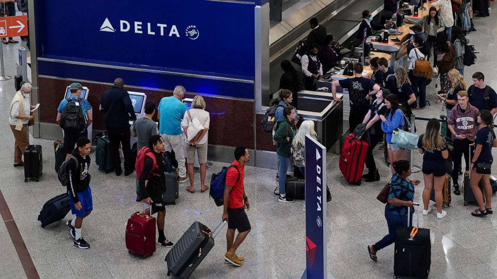 PHOTO: Passengers are seen at the Delta Air Lines check in area before their flights at Hartsfield-Jackson Atlanta International Airport in Atlanta, June 28, 2022. 