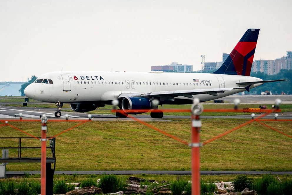 PHOTO: A Delta jet taxis before take off at Ronald Reagan Washington National Airport in Arlington, Va., June 27, 2022. 