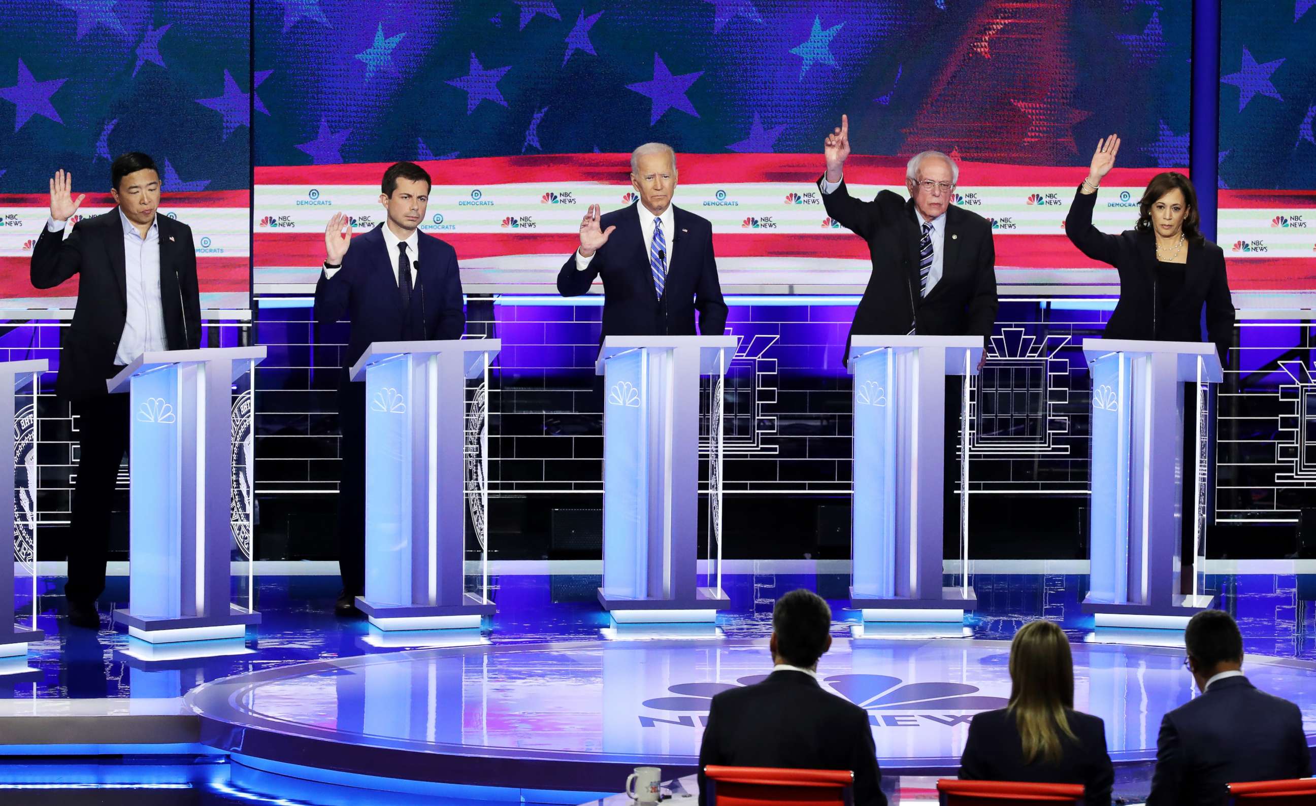 PHOTO: Democratic presidential candidates raise their hands during the second night of the first Democratic presidential debate on June 27, 2019 in Miami, Florida.