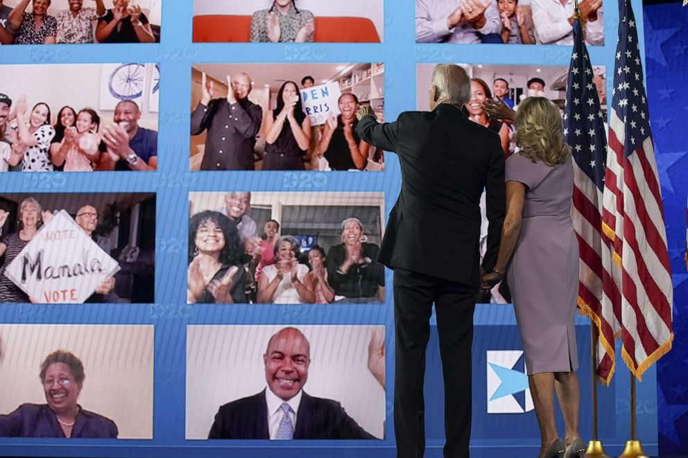 PHOTO: Joe Biden and wife Jill Biden look at viewers watching virtually during the Democratic National Convention at the Chase Center in Wilmington, Del., Aug. 20, 2020.