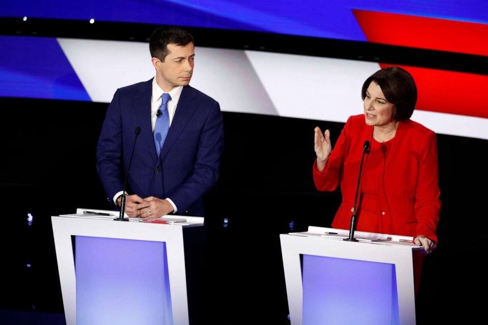 PHOTO: Sen. Amy Klobuchar answers a question as former South Bend Mayor Pete Buttigieg listens, Jan. 14, 2020, during a Democratic presidential primary debate hosted by CNN and the Des Moines Register in Des Moines, Iowa.