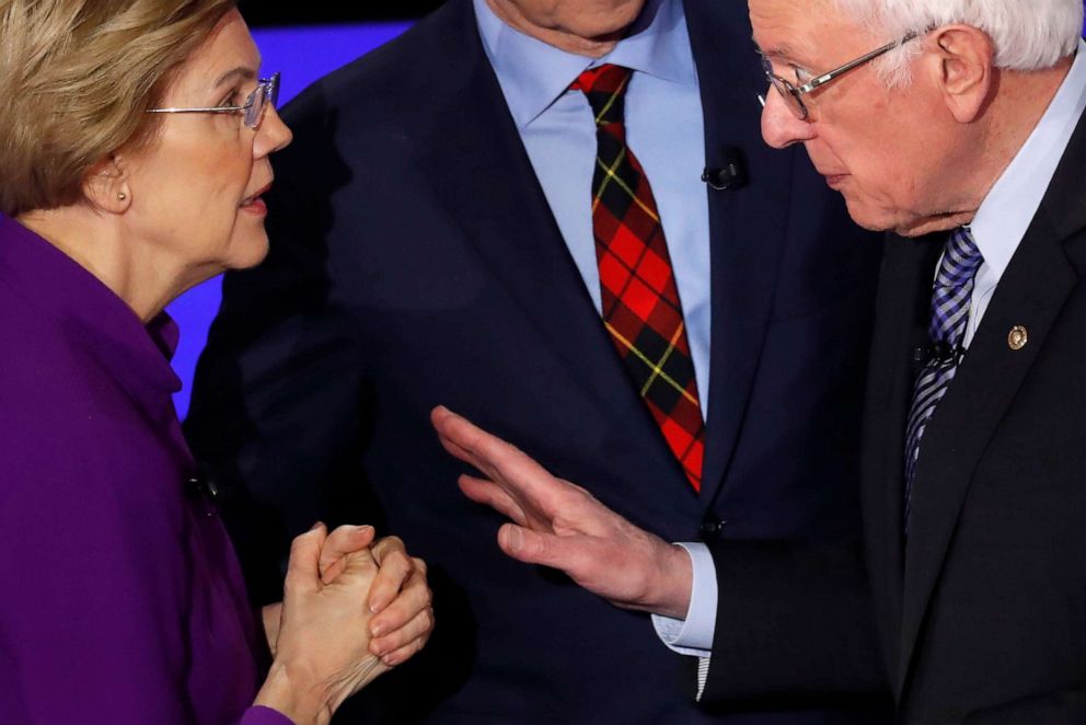 PHOTO: Sen. Elizabeth Warren speaks with Sen. Bernie Sanders after the seventh Democratic 2020 presidential debate at Drake University in Des Moines, Iowa, Jan. 14, 2020.