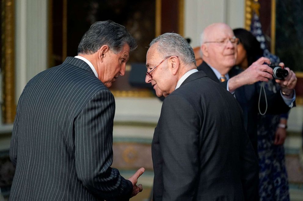 PHOTO: In this March 15, 2022, file photo, Sen. Joe Manchin talks with Senate Majority Leader Chuck Schumer on the White House campus in Washington, D.C.