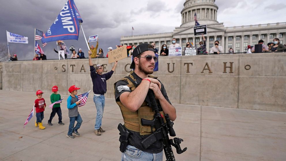 PHOTO: Supporters of President Donald Trump and people celebrating after media organizations declared Joe Biden President-elect, stage a rally outside the Utah State Capitol, Nov. 7, 2020, in Salt Lake City.