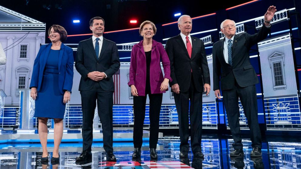 PHOTO: Presidential candidates appear on stage at the start of he Democratic presidential debate at Tyler Perry Studios on Nov. 20, 2019, in Atlanta.