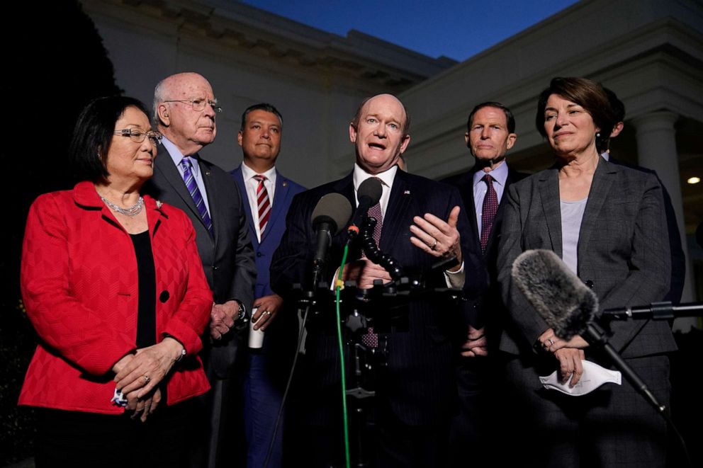 PHOTO: Sen. Chris Coons, center, speaks with reporters after he and Democratic members of the Senate Judiciary Committee met with President Joe Biden to discuss the upcoming Supreme Court vacancy, Feb. 10, 2022, at the White House.