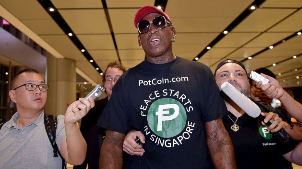 Retired American professional basketball player Dennis Rodman speaks to the press as he arrives at Changi International airport ahead of US-North Korea summit in Singapore, June 11, 2018.