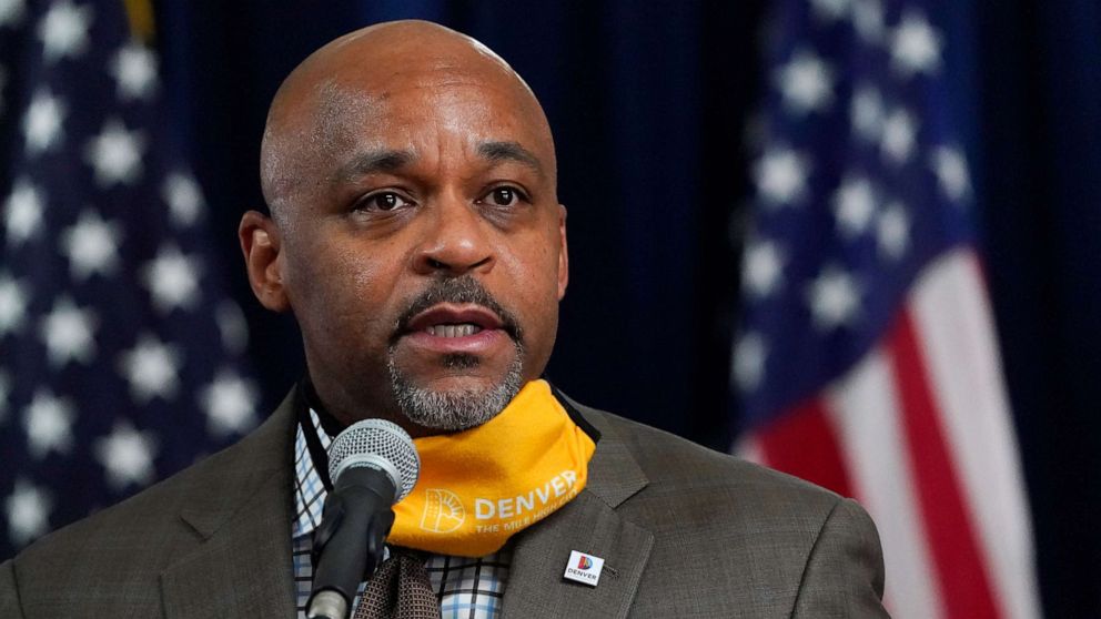 PHOTO: Denver Mayor Michael Hancock makes a point during a news conference about the rapid increase in coronavirus cases in the state Tuesday, Nov. 17, 2020, in Denver.