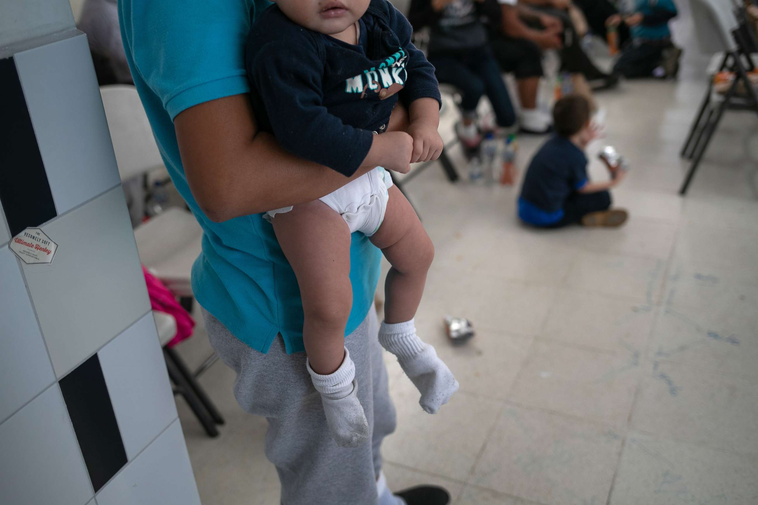 PHOTO: A young mother holds her infant after they arrived on an ICE deportation flight from Brownsville, Texas on Aug. 29, 2019, to Guatemala City.