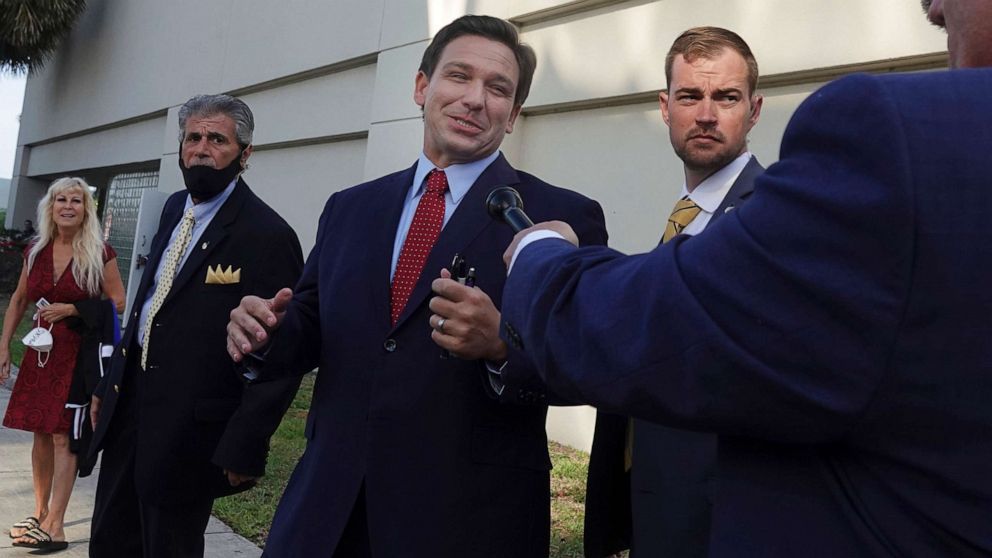 PHOTO: Florida Gov. Ron DeSantis leaves after an appearance, May 6, 2021, in West Palm Beach, Fla.