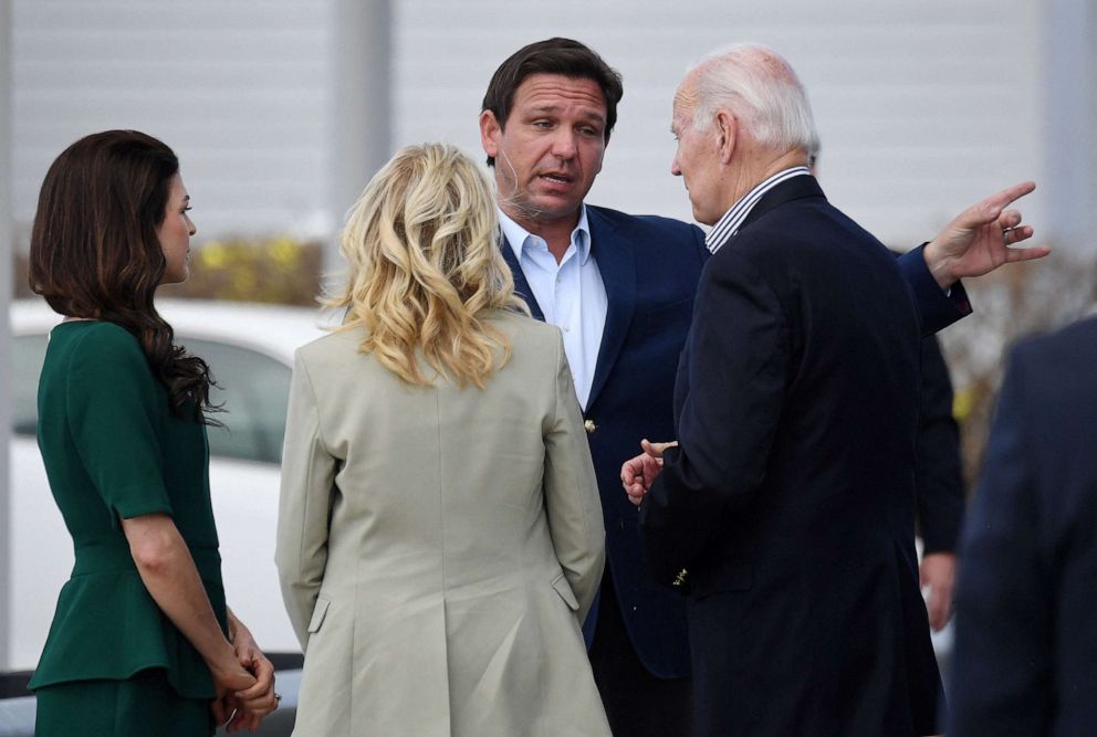 PHOTO: In this Oct. 5, 2022, file photo, Florida Governor Ron DeSantis, his wife Casey, President Joe Biden, and First Lady Jill Biden chat during a visit to impacted areas by Hurricane Ian at Fishermans Pass in Fort Myers, Fla.
