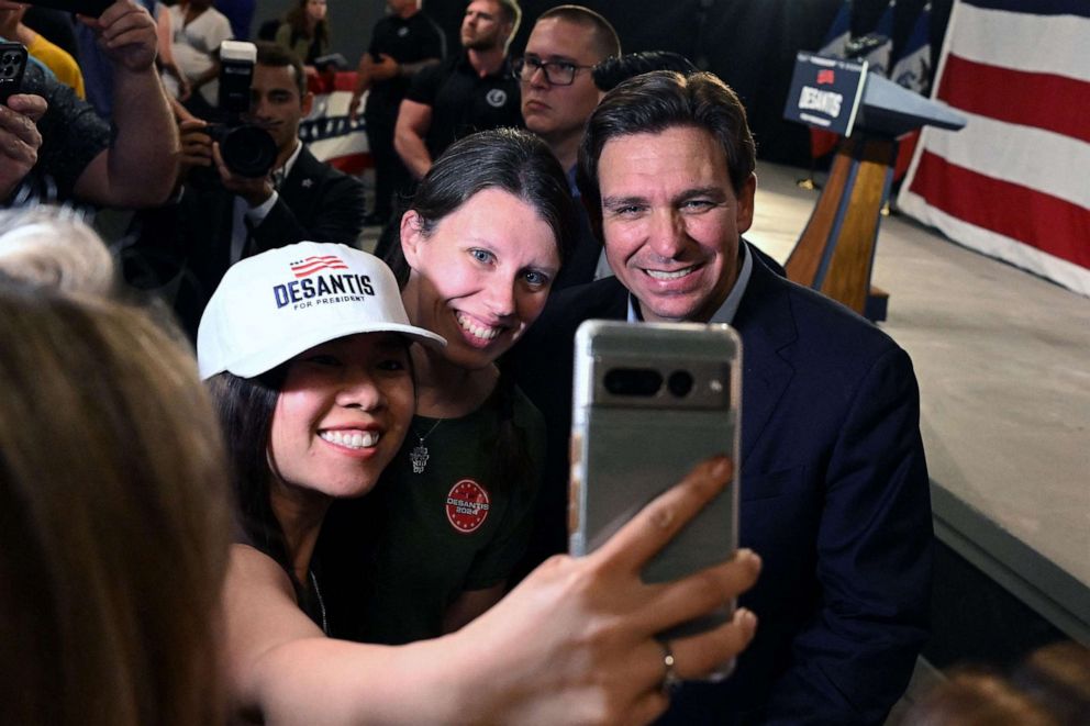 PHOTO: Florida Governor and 2024 Presidential hopeful Ron DeSantis poses for photos with supporters after speaking during his campaign kickoff event at Eternity Church, in Clive, Iowa, on May 30, 2023.