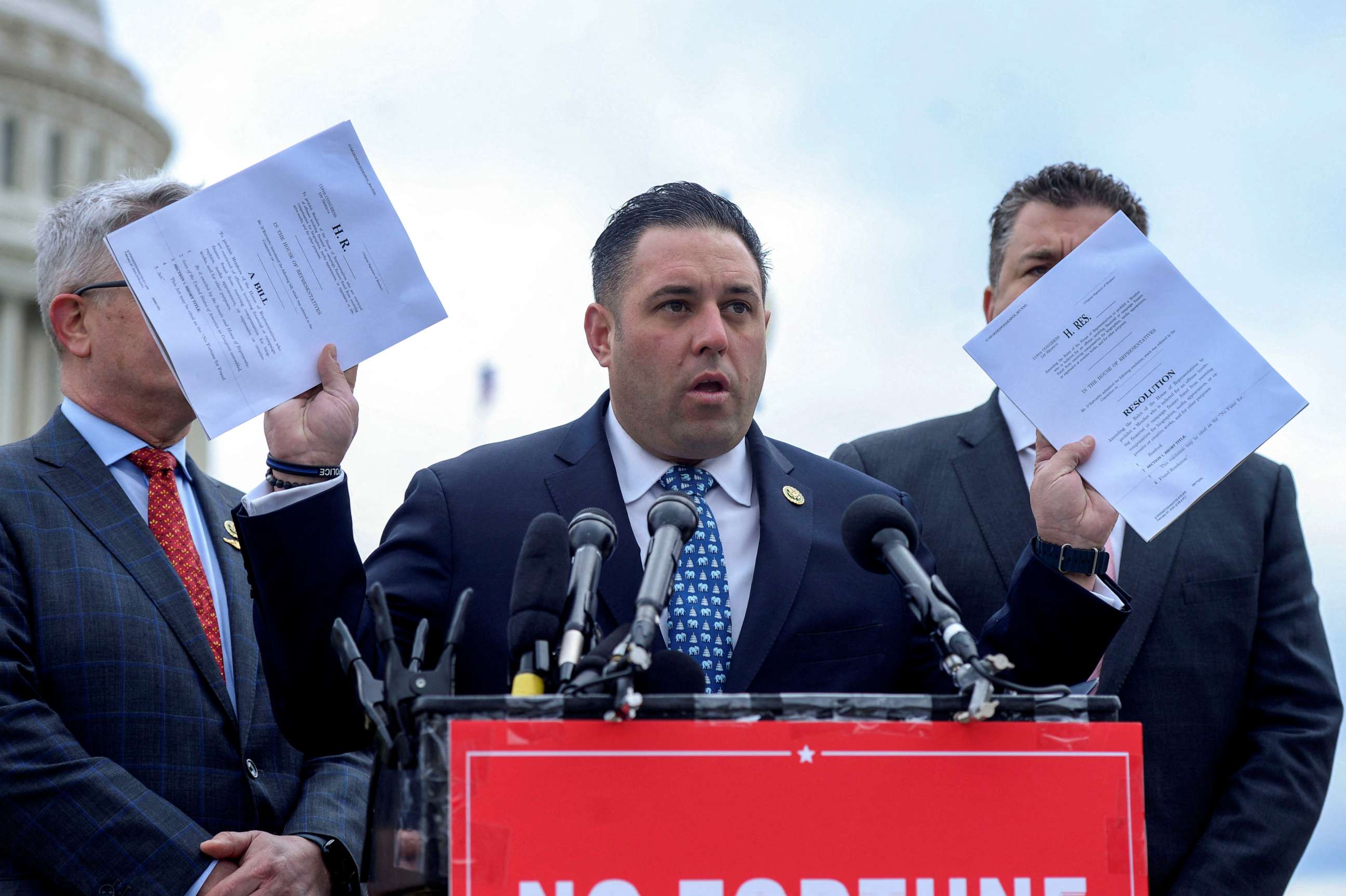 PHOTO: Rep. Anthony D'Esposito holds a copy of the "No Fortune for Fraud" Act, a law prohibiting House lawmakers convicted of certain offenses from profiting off their fabrications, during a press conference on Capitol Hill in Washington, March 7, 2023.