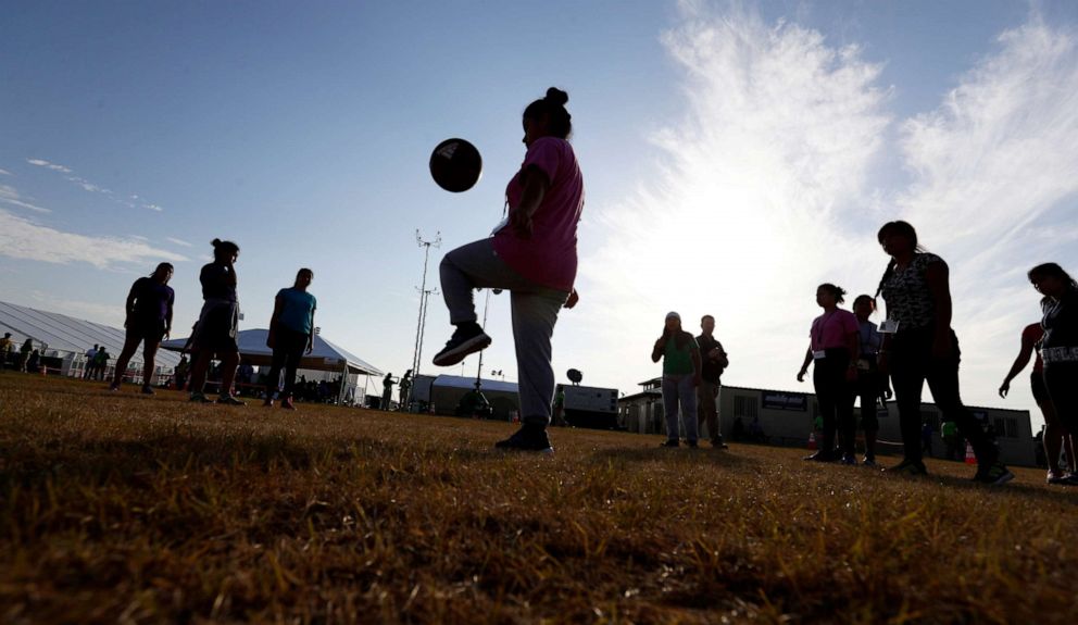 PHOTO: Immigrants play soccer at the U.S. government's newest holding center for migrant children in Carrizo Springs, Texas, July 9, 2019.