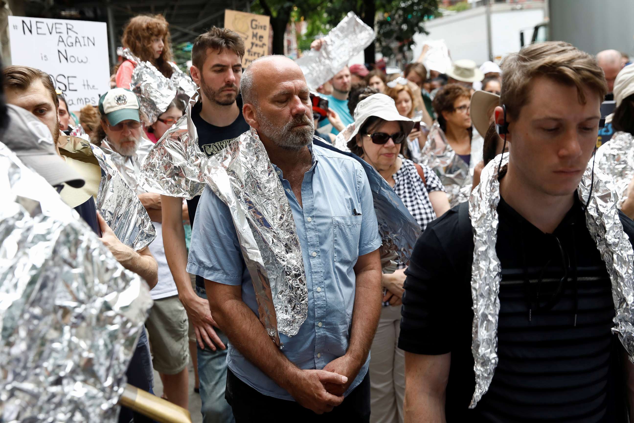 PHOTO: Demonstrators take a moment of silence in a 'Close the Camps' rally to demand the closure of inhumane immigrant detention centers outside the Middle Collegiate Church in New York, July 2, 2019.