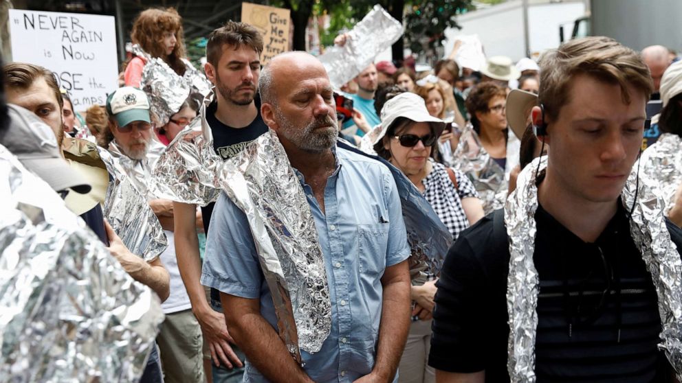 PHOTO: Demonstrators take a moment of silence in a 'Close the Camps' rally to demand the closure of inhumane immigrant detention centers outside the Middle Collegiate Church in New York, July 2, 2019.